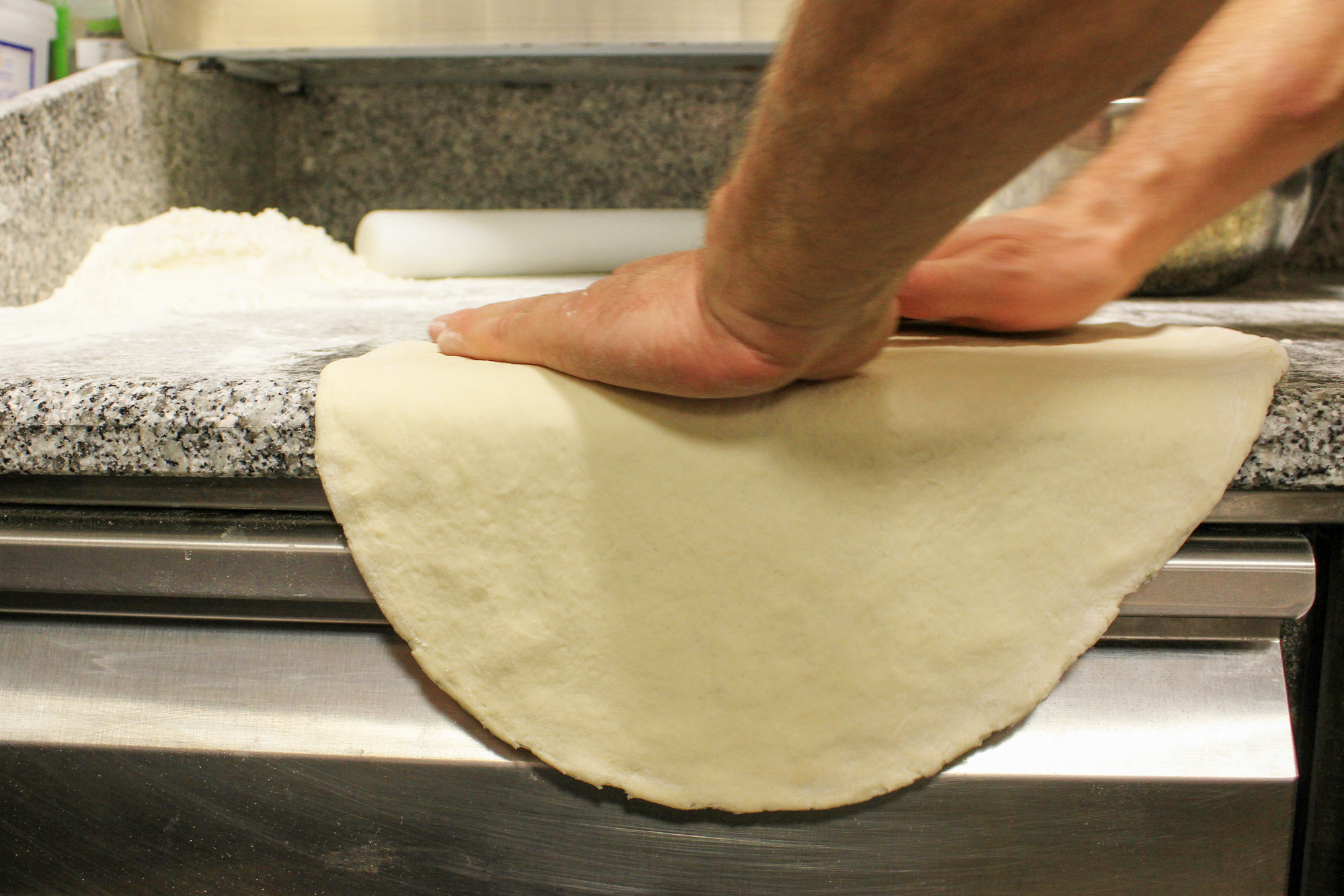 chef making fresh pizza